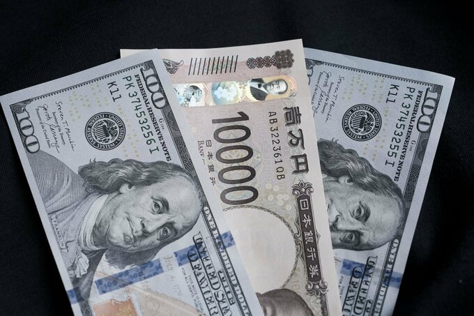 円は対ドルで147円台前半、株高安心し円売り先行－連休前下げ渋りも